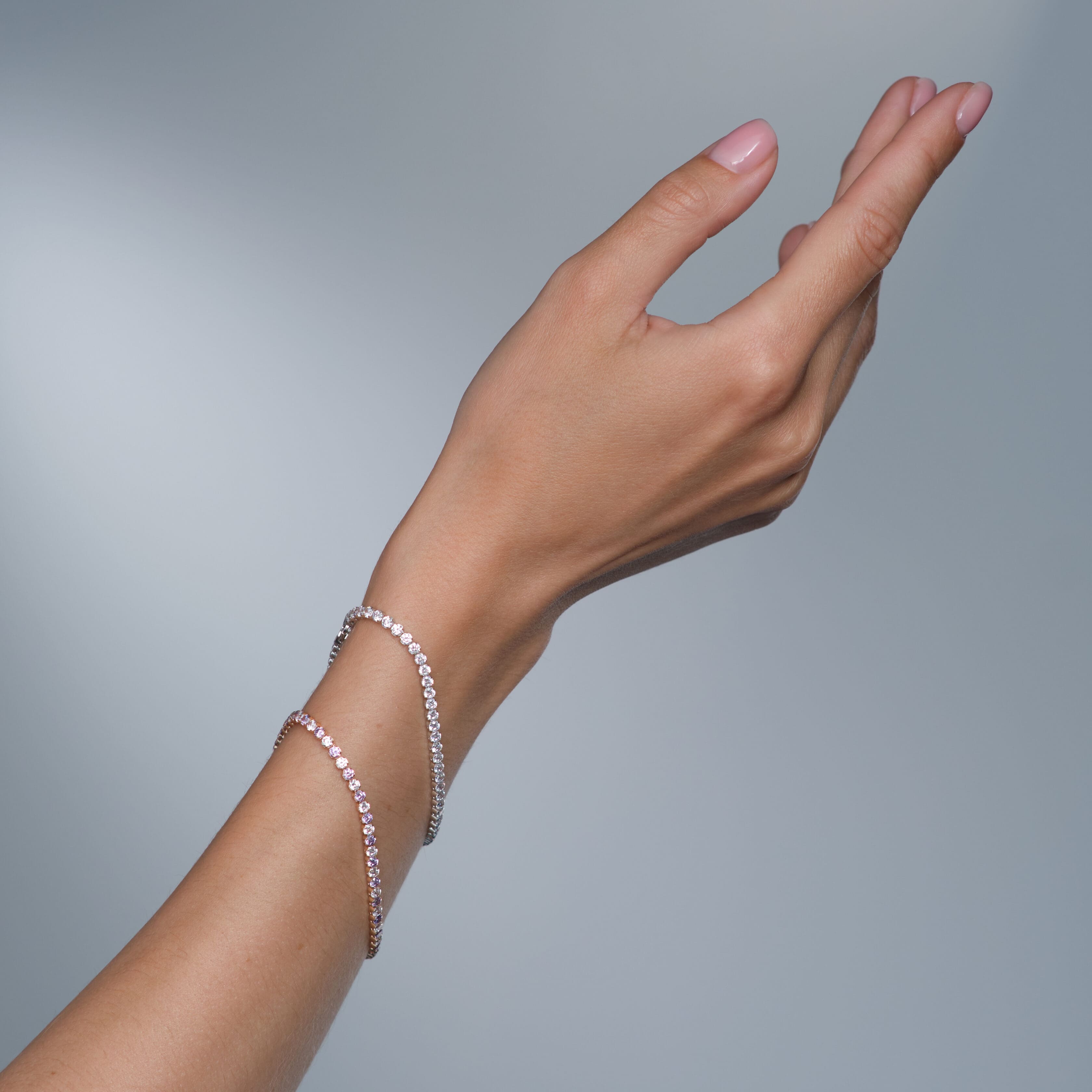 Woman jewelery concept Woman hands close up wearing rings earrings